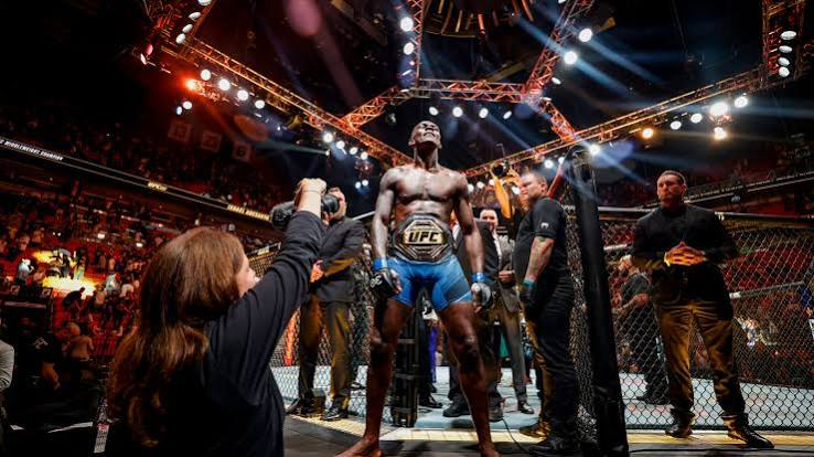 Adesanya stands on the fence, belt reclaimed, Miami