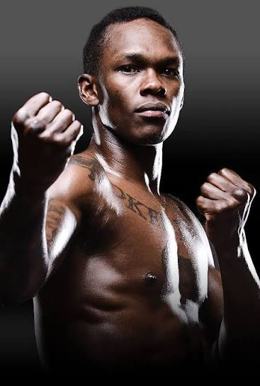Israel Adesanya, fists raised